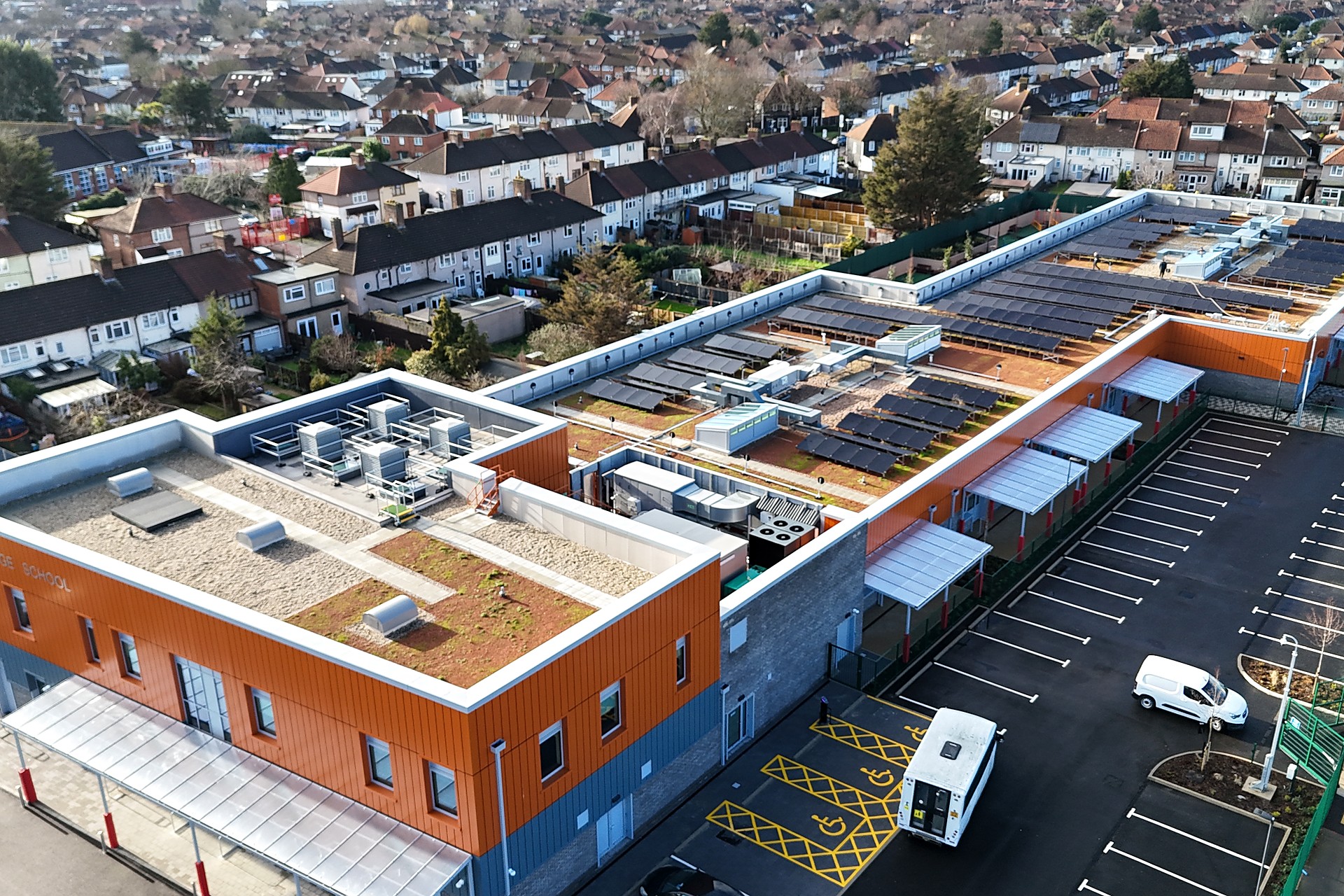 Aerial view of a complex commercial roof with rooflights, plant zones and waterproofing details