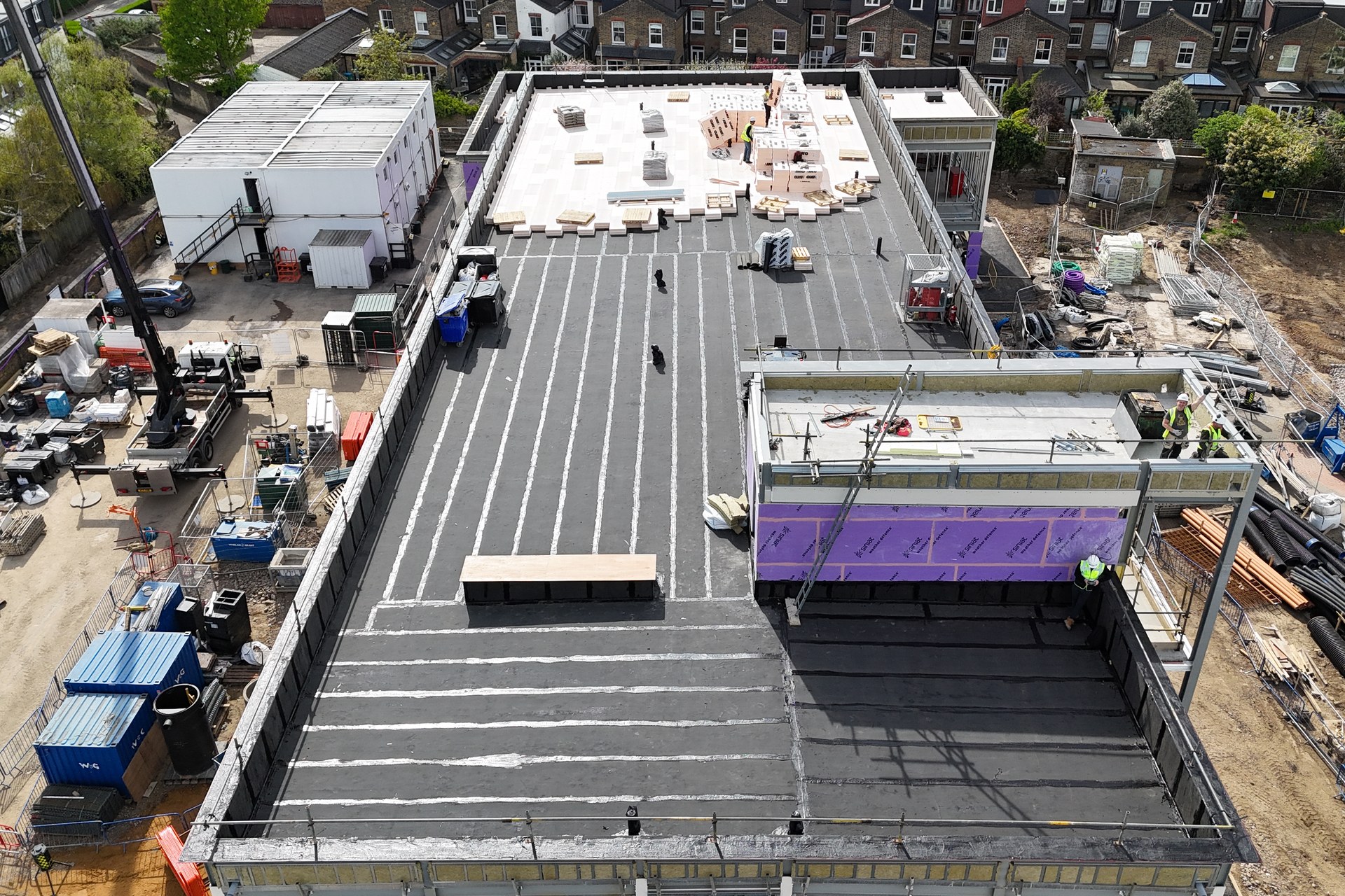 Aerial view of hot melt waterproofing works on a commercial roof
