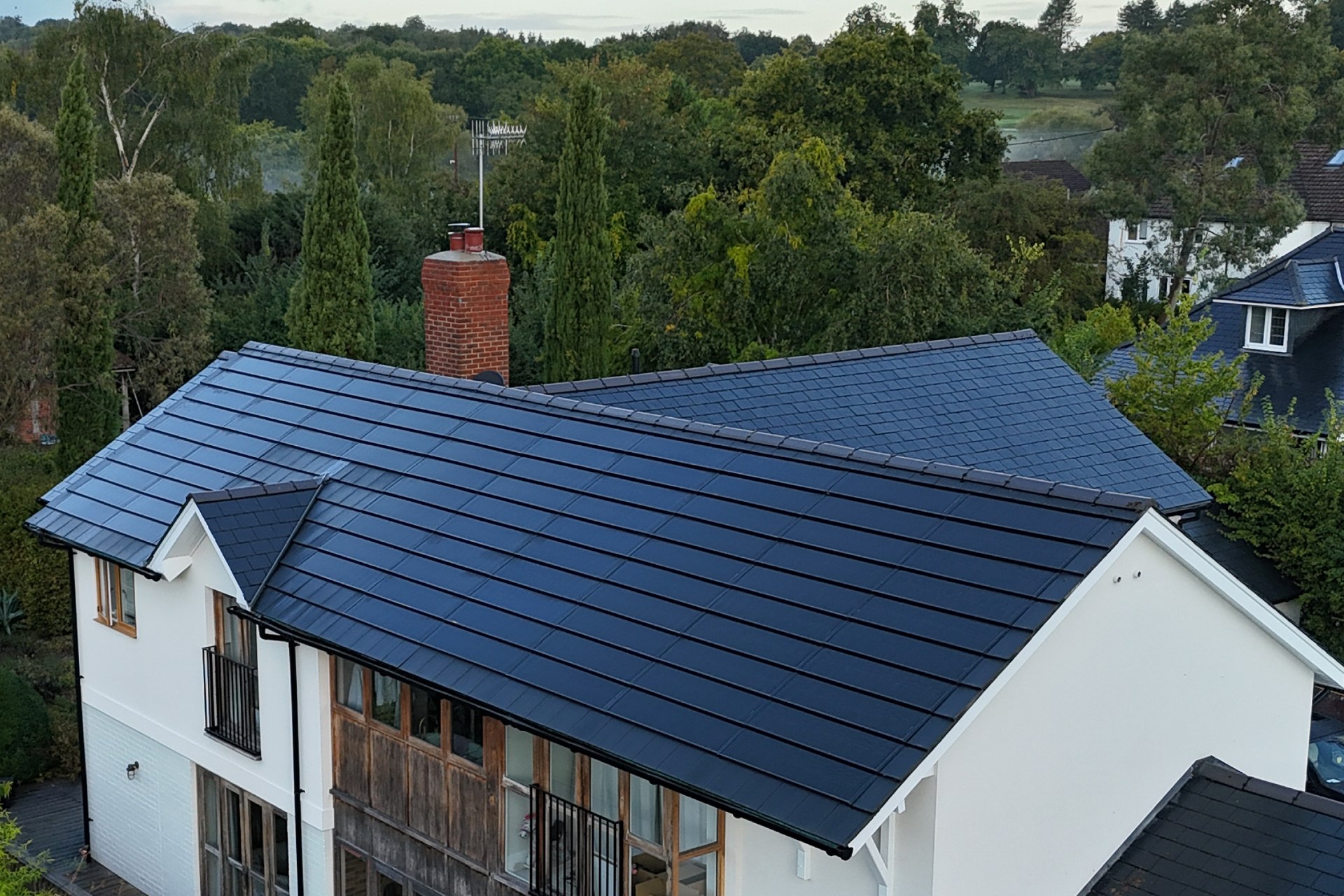 Pitched roof with integrated solar tiles